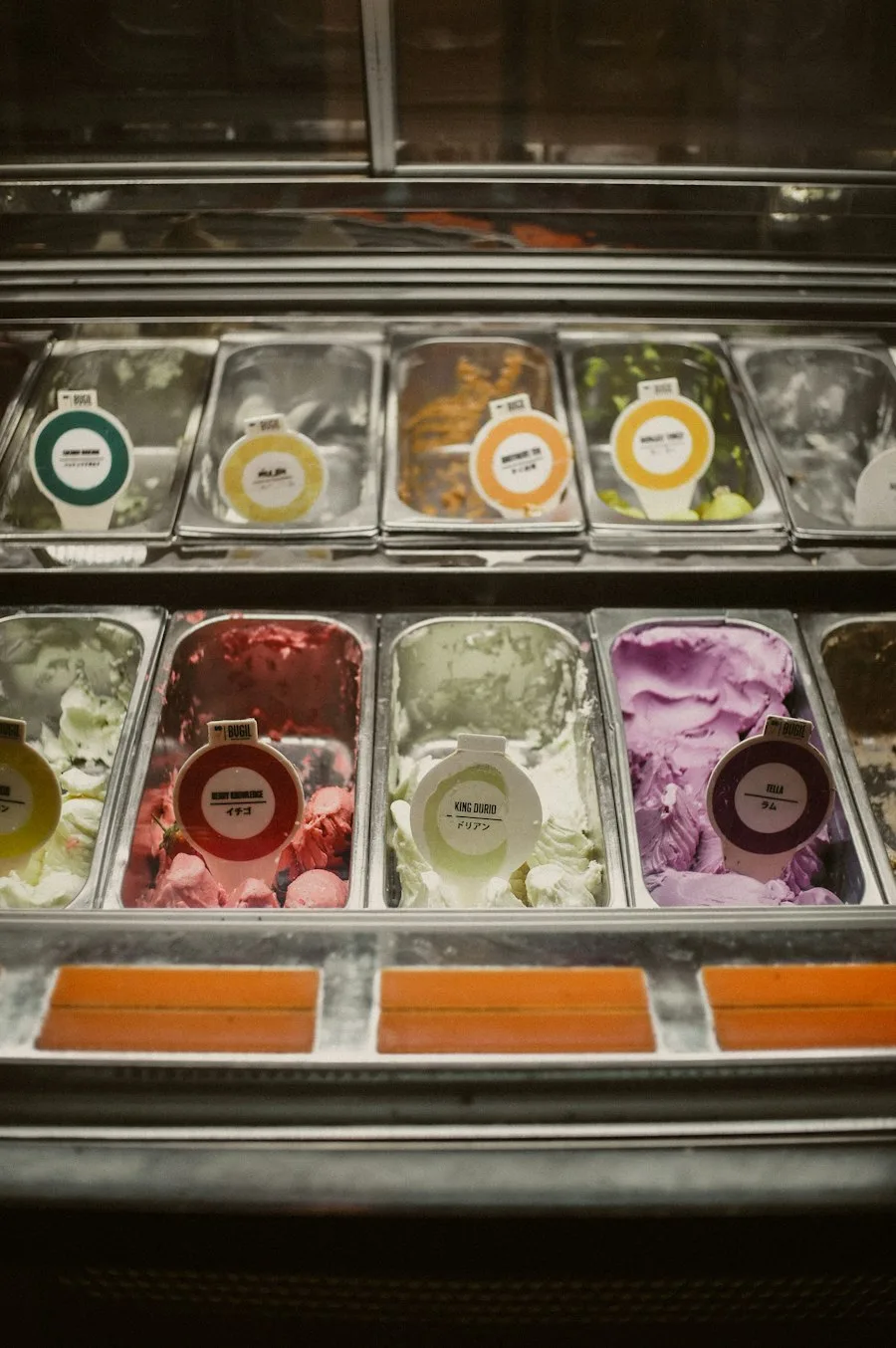 Gelato display case with many flavors