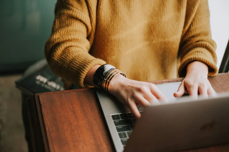 Person browsing a laptop